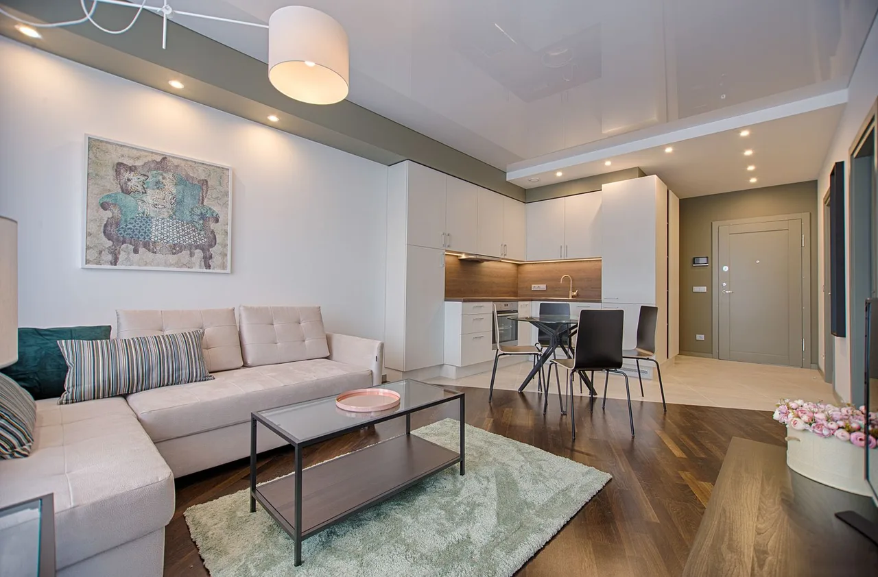 Bright condo living area open to a kitchen