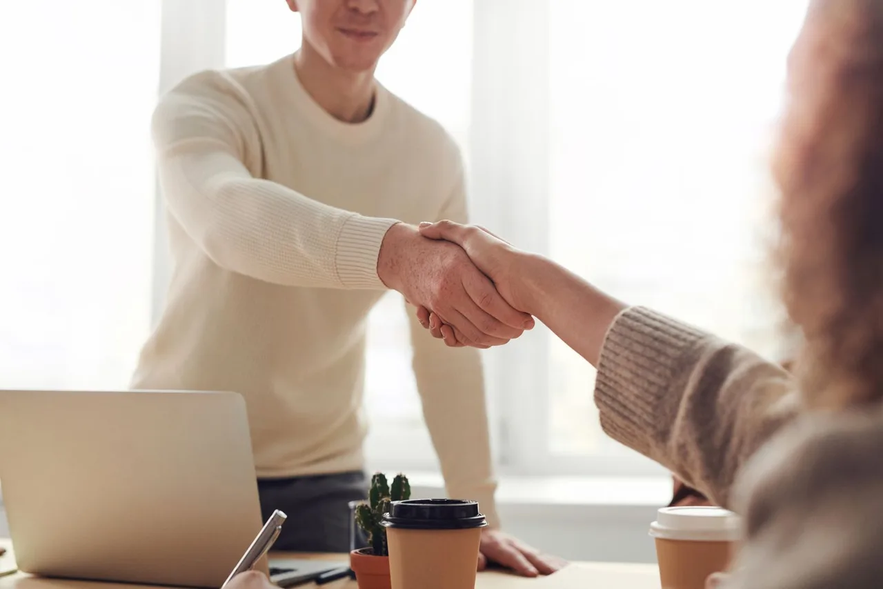 Closing handshake after a home sale